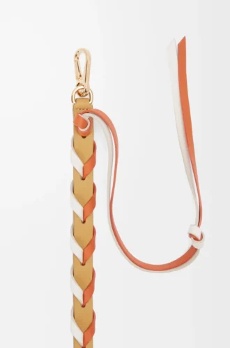 Dünner geflochtener Riemen aus klassischem Kalbsleder in Soft White/Maple Orange