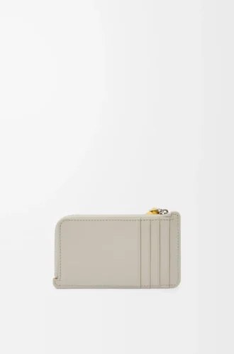 Knoten-Münzkartenetui aus glänzendem Nappakalbsleder Shell Grey/Dandelion